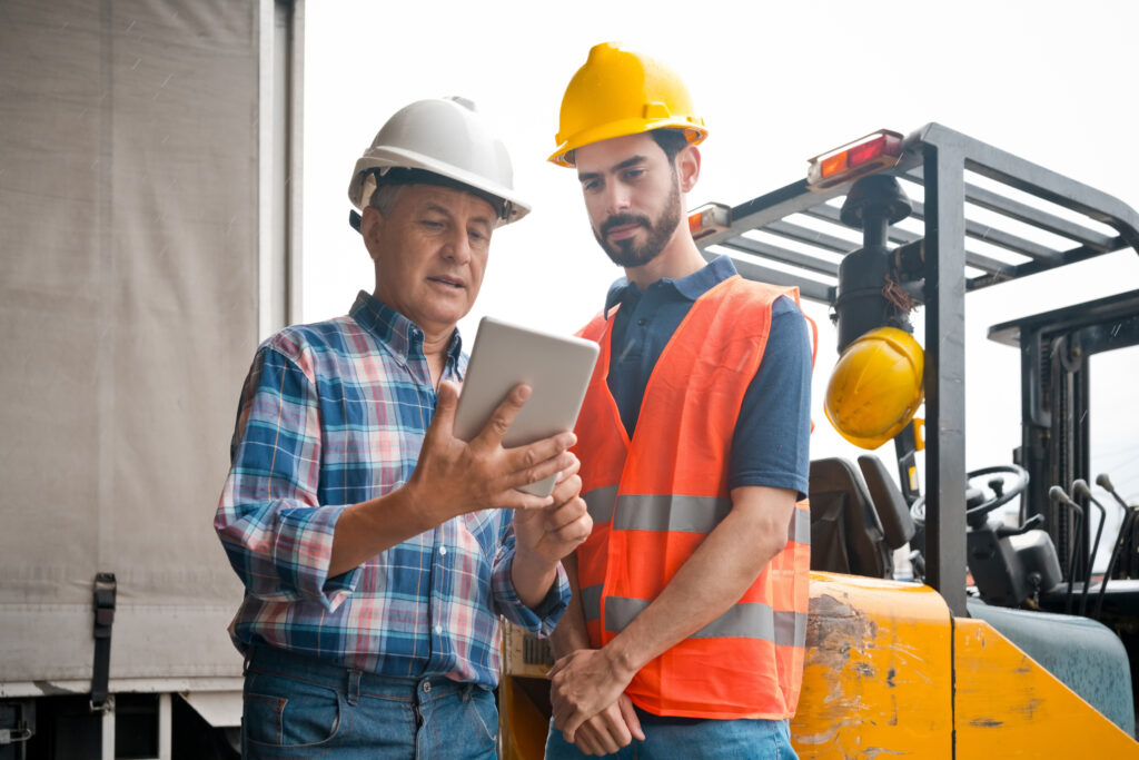 Motivated blue-collar workers collaborating on-site