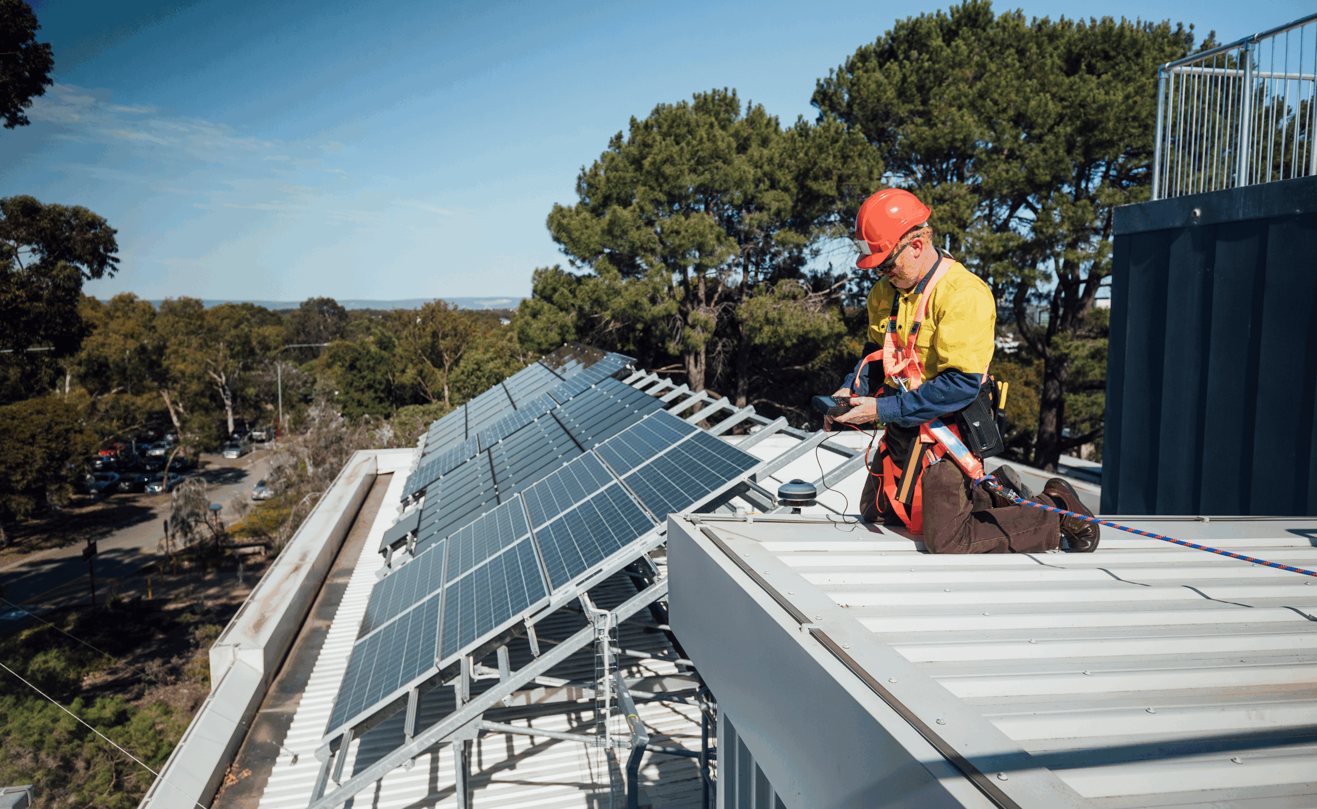 Confident electrical apprentice working at job site