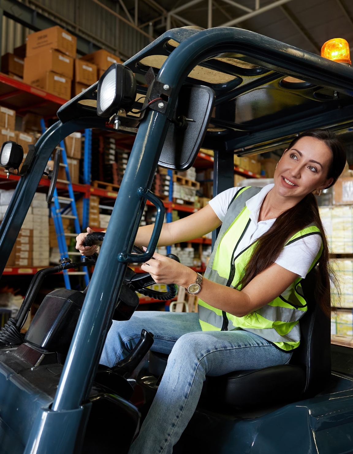 Female Forklift driver in warehouse