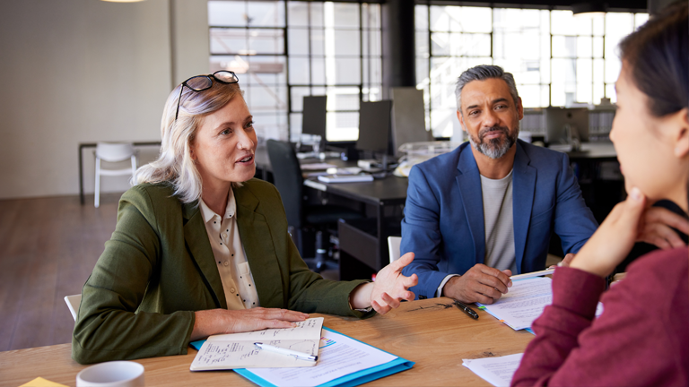 Managers discussing workplace relations.